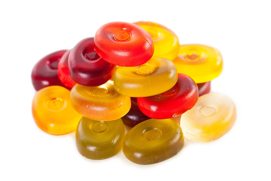 High-quality gummy supplement manufacturing at Biowell Labs—assorted colorful gummy vitamins showcasing premium private label supplements, contract supplement manufacturing, and Halal and Kosher certified supplements in a Health Canada approved facility.