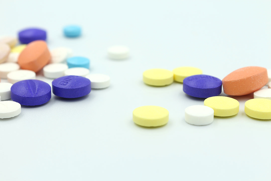 Colorful nutraceutical tablets and supplements manufactured by Biowell Labs, showcasing high-quality tablet manufacturing, private label supplements, and contract supplement manufacturing in a Health Canada approved facility.